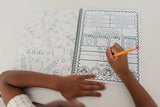 Child working on their personalized workbook. The child is filling out the calendar page and tracing their name.