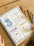 An example of the workbook page that a child has started to work on a color. The page has four sections. In one section there is the number 3 another section has a 3 to trace. Last section has an oval to trace and the last section has a color