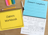 Image has two kindergarten workbook laid out. One is closed so you can see the personalized cover. The other is open to a page that has the childs name to trace and a calendar page with the date weather feelings and affirmations.