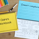 Image has two kindergarten workbook laid out. One is closed so you can see the personalized cover. The other is open to a page that has the childs name to trace and a calendar page with the date weather feelings and affirmations.